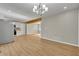 Bright living room with wood floors adjacent to open kitchen area at 5380 Saint Lo Ln, Atlanta, GA 30349