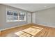 Bright living room with hardwood floors and large windows, filling the space with natural light at 5380 Saint Lo Ln, Atlanta, GA 30349