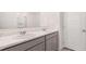 Bathroom features double sinks with white countertops, gray cabinets and modern chrome fixtures at 1009 Cades Walk, Lawrenceville, GA 30045