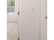 Bedroom showing window with blind and door at 1009 Cades Walk, Lawrenceville, GA 30045