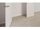 Hallway with neutral colored walls and carpeting at 1009 Cades Walk, Lawrenceville, GA 30045