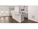 Modern kitchen with granite countertops, island, and stainless steel appliances at 1009 Cades Walk, Lawrenceville, GA 30045