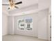 Main bedroom with carpet, ceiling fan, and large windows at 1009 Cades Walk, Lawrenceville, GA 30045
