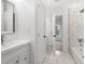 Modern bathroom with marble-tiled shower, marble floors, and a sleek vanity at 1835 W Taylor Ave, East Point, GA 30344