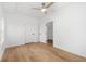 Bright bedroom with hardwood floors, ceiling fan, and white trim at 1835 W Taylor Ave, East Point, GA 30344