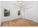 Cozy bedroom featuring hardwood floors, two windows and a closet at 1835 W Taylor Ave, East Point, GA 30344