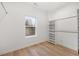 Walk-in closet featuring wood floors, a window, shelves and a closet rod at 1835 W Taylor Ave, East Point, GA 30344