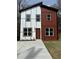 Modern two-story home with two-tone siding and a well-manicured front lawn at 1835 W Taylor Ave, East Point, GA 30344