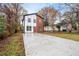 Well-maintained two-story home with modern siding and a long driveway in a quiet neighborhood at 1835 W Taylor Ave, East Point, GA 30344