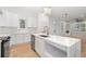 Spacious kitchen with white cabinets, marble countertops, stainless steel appliances, and large island at 1835 W Taylor Ave, East Point, GA 30344