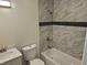 Updated bathroom with marble tile, new bathtub and fixtures at 5312 Westford Cir, Atlanta, GA 30349