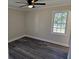 Spacious bedroom with new flooring and neutral wall colors at 5312 Westford Cir, Atlanta, GA 30349