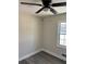 Well-lit bedroom with gray vinyl flooring and a window at 5312 Westford Cir, Atlanta, GA 30349
