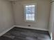 Bright bedroom with gray vinyl flooring and a large window at 5312 Westford Cir, Atlanta, GA 30349