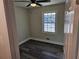 Cozy bedroom featuring gray vinyl flooring and a window at 5312 Westford Cir, Atlanta, GA 30349