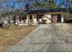 Newly renovated Ranch home with updated exterior and driveway at 5312 Westford Cir, Atlanta, GA 30349