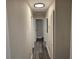 Long hallway with gray vinyl flooring and neutral walls at 5312 Westford Cir, Atlanta, GA 30349