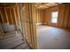 Unfinished basement with exposed framing ready for personalization with a bright window at 101 Azalea Dr, Villa Rica, GA 30180