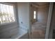 Bright bathroom features a soaking tub beneath a large window offering views of the wooded property at 101 Azalea Dr, Villa Rica, GA 30180