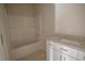 Bathroom features a tub with shower and vanity with granite counters at 101 Azalea Dr, Villa Rica, GA 30180