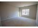Spacious bedroom with ample natural light from a large window at 101 Azalea Dr, Villa Rica, GA 30180