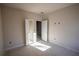 Spacious bedroom with sunlight and open doorway to the next room at 101 Azalea Dr, Villa Rica, GA 30180