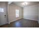 Well lit dining room with crown moulding, chair rail, and new light fixture at 101 Azalea Dr, Villa Rica, GA 30180