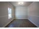 Bright dining room with crown moulding, chair rail, and natural light at 101 Azalea Dr, Villa Rica, GA 30180
