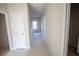 Second floor hallway with neutral walls, leading to various rooms in the home at 101 Azalea Dr, Villa Rica, GA 30180