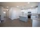Open kitchen layout featuring an island, stainless steel appliances, and sleek cabinetry at 101 Azalea Dr, Villa Rica, GA 30180