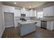 Modern kitchen with stainless steel appliances, white cabinets, and granite countertops at 101 Azalea Dr, Villa Rica, GA 30180
