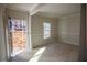 Spacious living room with natural light entering from a window and a door at 101 Azalea Dr, Villa Rica, GA 30180