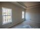 Main bedroom with tray ceiling, neutral paint, and ample natural light at 101 Azalea Dr, Villa Rica, GA 30180