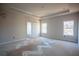 Main bedroom with tray ceiling, neutral paint, and ample natural light at 101 Azalea Dr, Villa Rica, GA 30180