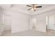 Open bedroom with ceiling fan and access to the Primary bath and large walk-in closet at 989 Cades Walk, Lawrenceville, GA 30045