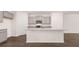 Modern kitchen with gray cabinets, granite countertops, and stainless steel appliances at 989 Cades Walk, Lawrenceville, GA 30045