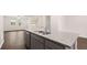 Close-up of kitchen island with granite countertop and stainless steel sink at 989 Cades Walk, Lawrenceville, GA 30045