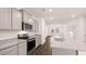 Well-lit kitchen featuring granite countertops, stainless steel appliances and ample cabinet space at 989 Cades Walk, Lawrenceville, GA 30045
