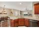 Open kitchen featuring granite countertops, stainless steel appliances, and a breakfast bar adjacent to the dining area at 241 Kigian Trl, Woodstock, GA 30188