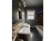 Bathroom with updated vanity and dark tile floors at 880 Cascade Sw Rd, Atlanta, GA 30311