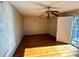 Bright bedroom featuring hardwood floors and a door to exterior at 880 Cascade Sw Rd, Atlanta, GA 30311