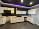 Modern kitchen with white cabinets, granite counters, and dark floors at 880 Cascade Sw Rd, Atlanta, GA 30311