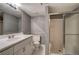 Neutral toned bathroom featuring a large vanity, toilet, and glass door shower at 3634 Autumn Ridge Pkwy, Marietta, GA 30066