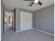 Bedroom featuring carpet, closet and access to hallway at 3634 Autumn Ridge Pkwy, Marietta, GA 30066