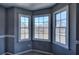 A bedroom with three windows overlooking a lake at 3634 Autumn Ridge Pkwy, Marietta, GA 30066