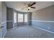 A bedroom with a ceiling fan and three windows at 3634 Autumn Ridge Pkwy, Marietta, GA 30066