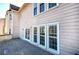 Exterior shot of the home with a wooden deck and multiple windows overlooking the backyard at 3634 Autumn Ridge Pkwy, Marietta, GA 30066