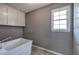 A laundry room with a utility sink and a window at 3634 Autumn Ridge Pkwy, Marietta, GA 30066