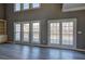 Bright living room boasting new floors, fresh paint, three large windows and access to the porch at 3634 Autumn Ridge Pkwy, Marietta, GA 30066