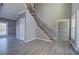 Bright living room featuring new floors, fresh paint, wooden staircase and natural light at 3634 Autumn Ridge Pkwy, Marietta, GA 30066